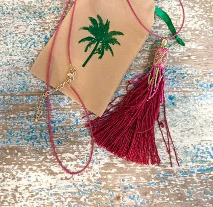 Pink tassel necklace on cord