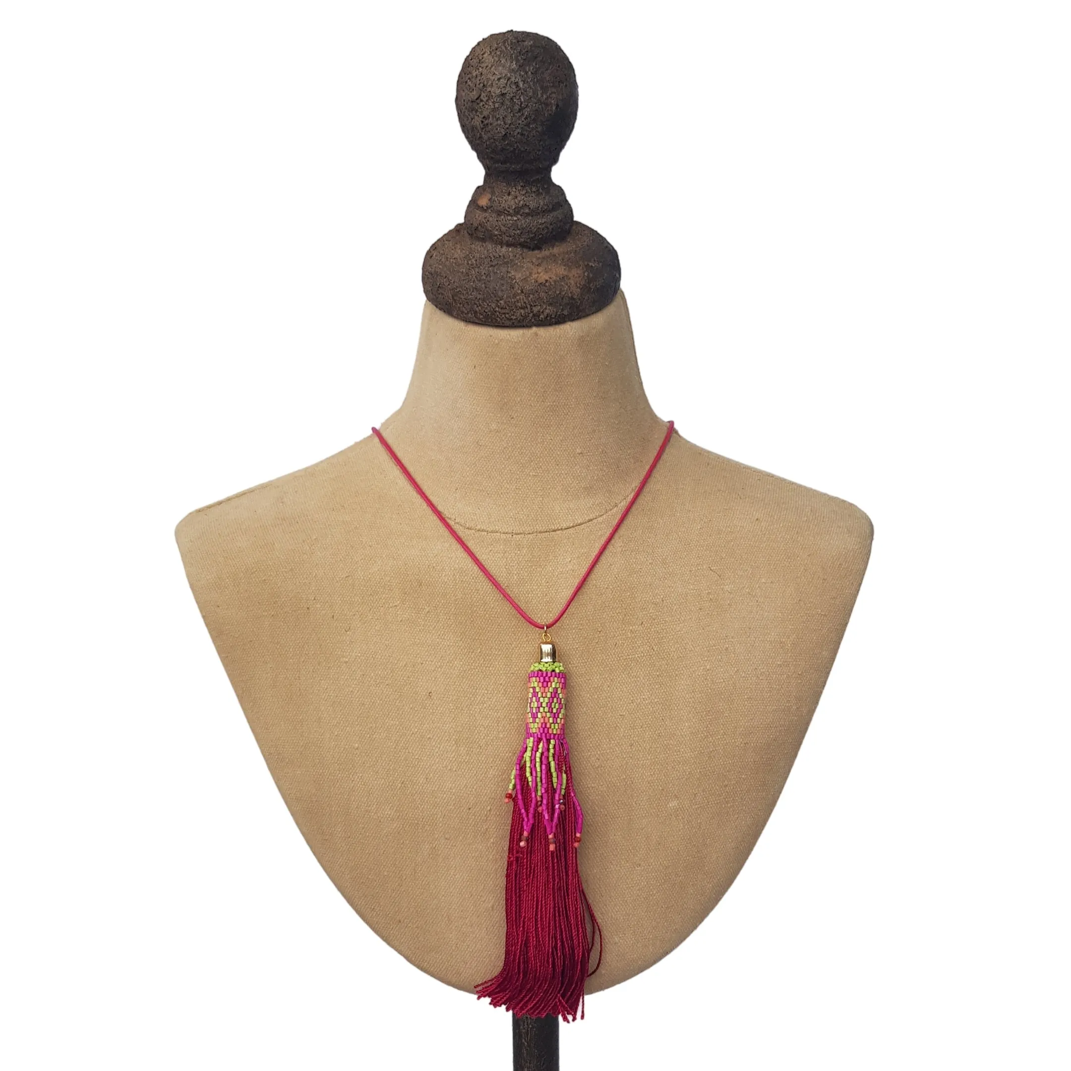 Pink tassel necklace on cord